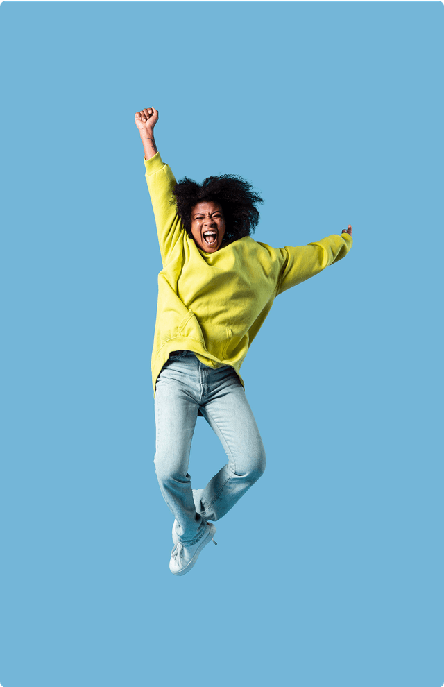 Person jumping with joy against blue background